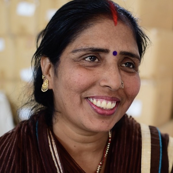 A Health Leader smiles at the camera.